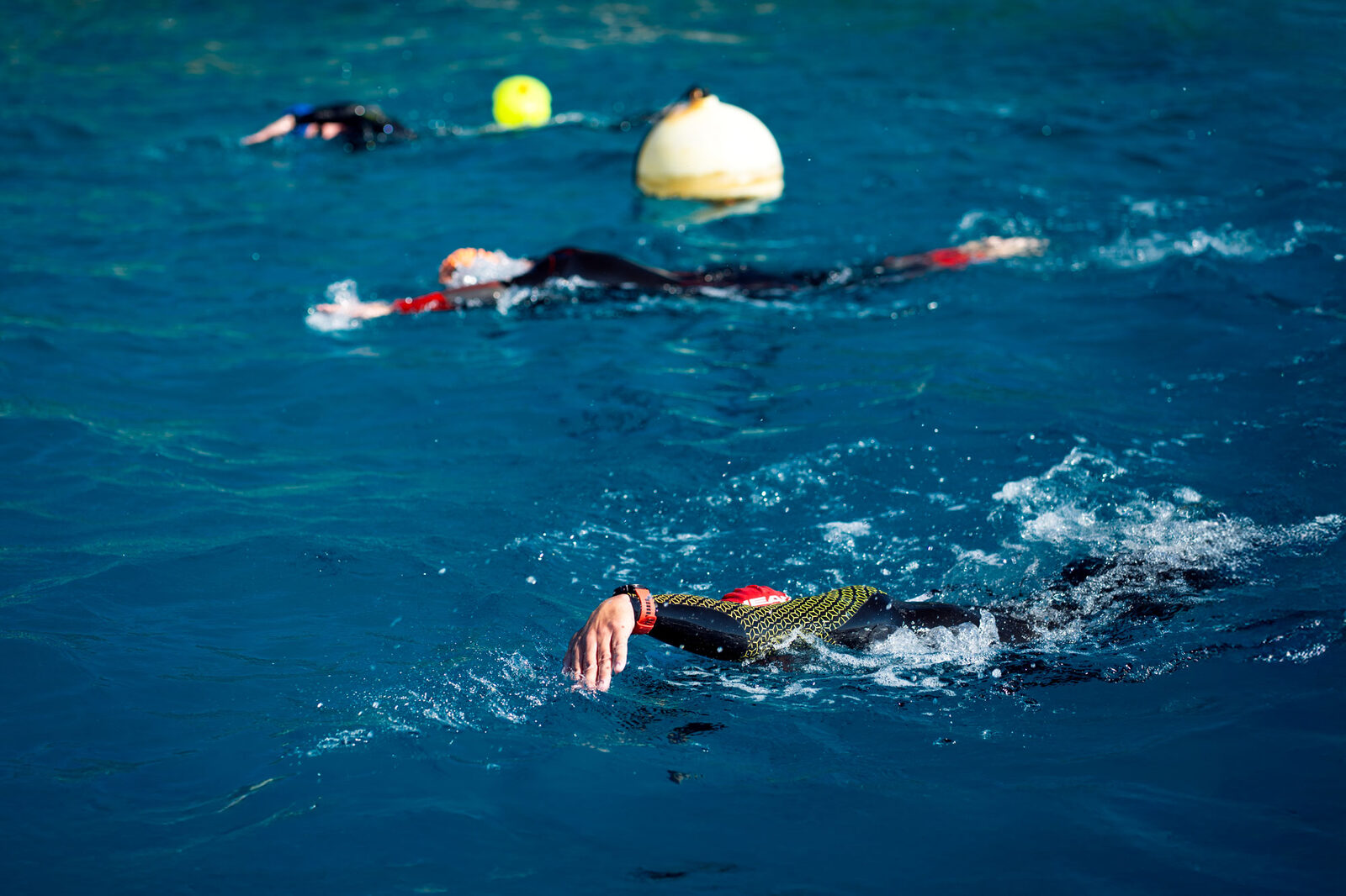 Open water swimmer with tow float