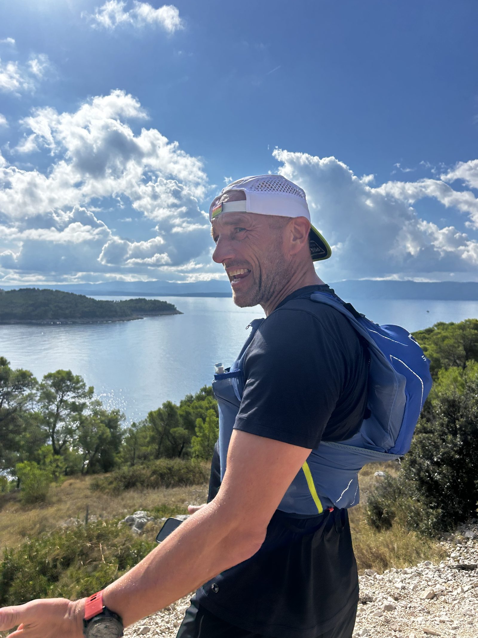 John Yelland running above the bay, Brač Island