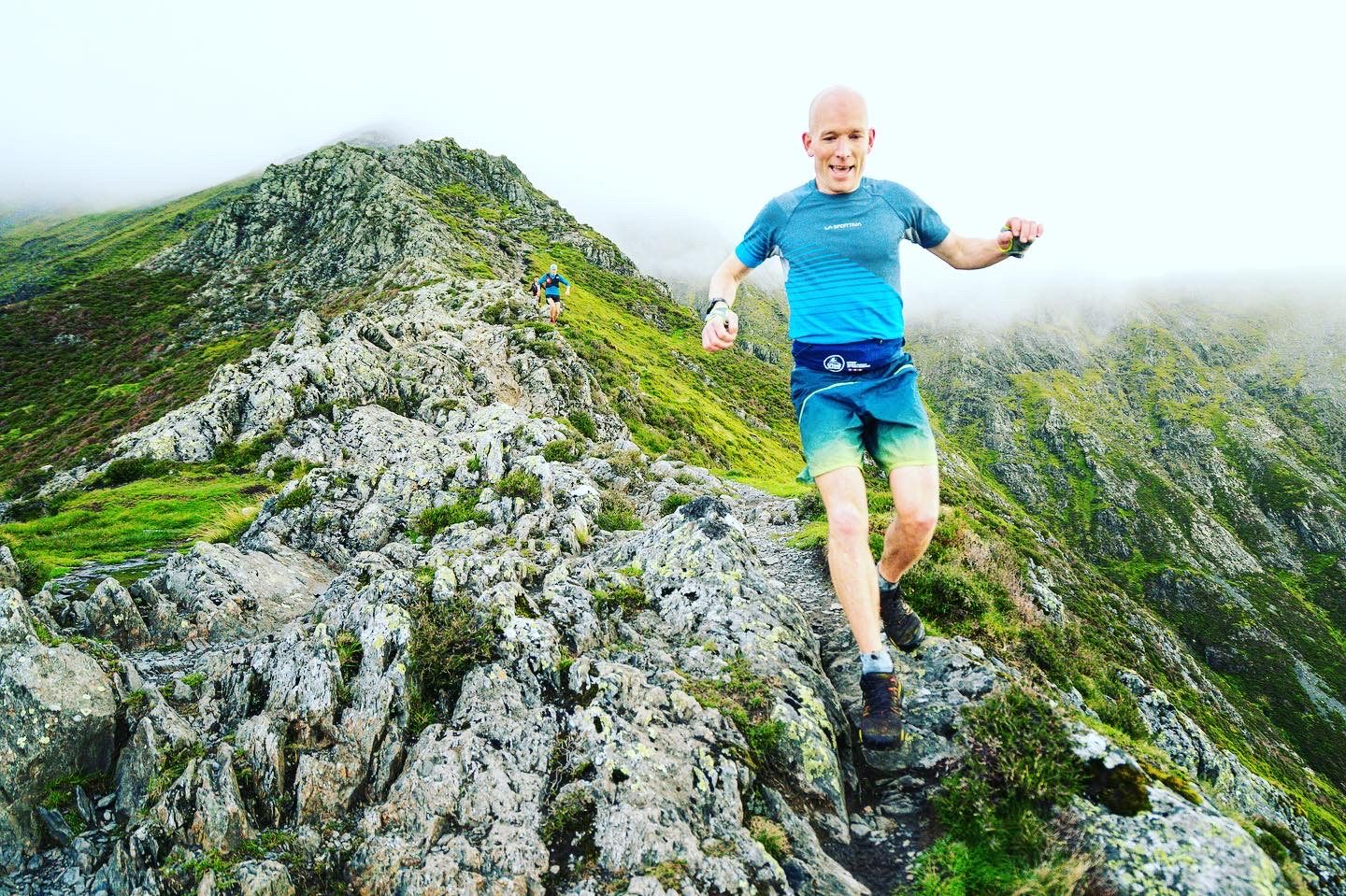 Kim Collison ridge running in fog